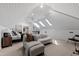 This living room features carpeted floors, a large sofa, recessed lighting, and skylights at 10805 The Olde Pl, Raleigh, NC 27614