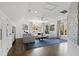 Spacious living room with hardwood floors, large sectional sofa, and an abundance of natural light at 10805 The Olde Pl, Raleigh, NC 27614