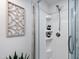 The shower features a clear glass door, a shower head, and built in shelves at 10805 The Olde Pl, Raleigh, NC 27614