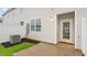 Backyard view with cozy patio, privacy fence, green grass, and modern exterior home design at 110 Red Maple St, Sanford, NC 27332