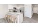 Bright kitchen with stainless steel appliances, breakfast bar, and modern finishes at 112 Red Maple St, Sanford, NC 27332