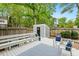 A peaceful outdoor deck space with comfortable seating, a storage shed, and a fenced-in yard at 120 Barbary Ct, Cary, NC 27511