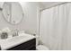 Cozy bathroom with a vanity and a shower with a curtain at 120 Barbary Ct, Cary, NC 27511