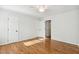 Bedroom featuring hardwood floors, a ceiling fan, and multiple closets at 120 Barbary Ct, Cary, NC 27511