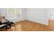 Bright bedroom with hardwood floors, a window and neutral paint at 120 Barbary Ct, Cary, NC 27511