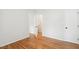 This bedroom has hardwood flooring and doors leading into other rooms at 120 Barbary Ct, Cary, NC 27511