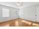 Bedroom featuring two large windows, and hardwood floors at 120 Barbary Ct, Cary, NC 27511
