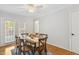 Dining room featuring hardwood floors, natural light, and modern decor at 120 Barbary Ct, Cary, NC 27511