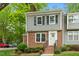 Charming two-story home with brick and gray siding, landscaped yard, and a welcoming front entrance at 120 Barbary Ct, Cary, NC 27511