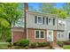 Charming brick and siding townhouse with a manicured lawn and inviting front entrance at 120 Barbary Ct, Cary, NC 27511