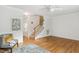 Spacious living room boasting gleaming hardwood floors and a staircase at 120 Barbary Ct, Cary, NC 27511