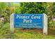 Pirates' Cove Park sign, a private facility for residents, surrounded by lush greenery at 120 Barbary Ct, Cary, NC 27511