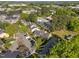 Aerial view featuring residential homes with mature trees in a community with well-maintained streets and parking areas at 1234 Shadowbark Ct, Raleigh, NC 27603