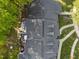 Aerial shot featuring the roof of a well-maintained home, a wooden deck, and mature trees at 1234 Shadowbark Ct, Raleigh, NC 27603