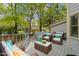 Back deck featuring patio furniture and a grill, perfect for outdoor entertaining at 1234 Shadowbark Ct, Raleigh, NC 27603