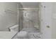 Bathroom featuring a glass shower stall, toilet, and marble tile flooring at 1234 Shadowbark Ct, Raleigh, NC 27603