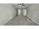 The bedroom has neutral walls, plush carpet, and features two separate entryways at 1234 Shadowbark Ct, Raleigh, NC 27603