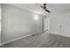 This bedroom boasts a ceiling fan, neutral walls, plush carpet, and an open closet area at 1234 Shadowbark Ct, Raleigh, NC 27603