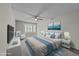 A bedroom featuring a bay window, ceiling fan, and two art pieces above the bed at 1234 Shadowbark Ct, Raleigh, NC 27603