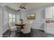 Dining room featuring a round table, modern chairs, and a large window at 1234 Shadowbark Ct, Raleigh, NC 27603
