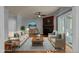 Living room featuring hardwood floors, sofas, a fireplace and sliding glass doors at 1234 Shadowbark Ct, Raleigh, NC 27603