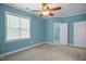A bedroom featuring carpet flooring and a ceiling fan at 126 W Savannah Ridge Rd, Holly Springs, NC 27540