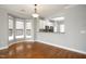 Cozy dining area with hardwood floors, modern lighting, and access to the kitchen at 126 W Savannah Ridge Rd, Holly Springs, NC 27540
