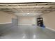 Attached garage with storage and painted floor at 126 W Savannah Ridge Rd, Holly Springs, NC 27540