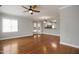 Inviting living room showcasing hardwood floors, natural light and an open layout to the kitchen at 126 W Savannah Ridge Rd, Holly Springs, NC 27540