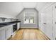 Charming, bonus room featuring a kitchenette with a beverage fridge and granite countertops at 1306 Mordecai Dr, Raleigh, NC 27604