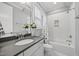 Well-lit bathroom with white subway tiles in the bath and shower, as well as stylish accents at 1306 Mordecai Dr, Raleigh, NC 27604