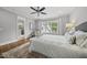 Comfortable bedroom with a ceiling fan, a plush rug and natural light streaming through the window at 1306 Mordecai Dr, Raleigh, NC 27604