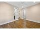 Bedroom featuring light walls, wood flooring, recessed lighting, and white painted doors at 1306 Mordecai Dr, Raleigh, NC 27604