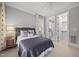 Tastefully decorated bedroom with an ensuite bathroom and walk-in closet at 1306 Mordecai Dr, Raleigh, NC 27604