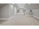 Spacious bonus room features a neutral carpet, recessed lighting, and natural light at 1306 Mordecai Dr, Raleigh, NC 27604