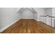 Large, bonus room featuring hardwood floors, neutral paint, recessed lights, and a sloped ceiling at 1306 Mordecai Dr, Raleigh, NC 27604