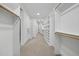 Large walk-in closet featuring extensive shelving and hanging space for optimal organization at 1306 Mordecai Dr, Raleigh, NC 27604