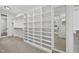 Spacious walk-in closet with built-in shelving and ample storage for clothing and accessories at 1306 Mordecai Dr, Raleigh, NC 27604