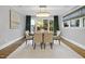 Stylish dining room featuring an elegant chandelier and large window at 1306 Mordecai Dr, Raleigh, NC 27604