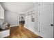 Spacious entryway boasts hardwood floors and custom built-ins with shelves and storage at 1306 Mordecai Dr, Raleigh, NC 27604