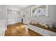 Inviting entryway with a built-in bench seat, storage drawers, and natural light at 1306 Mordecai Dr, Raleigh, NC 27604