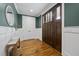Stunning foyer with hardwood floors, decorative mirror, and stylish wainscoting at 1306 Mordecai Dr, Raleigh, NC 27604