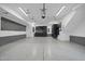 Well-organized garage featuring epoxy floors, custom cabinets, and mounted utility accessories at 1306 Mordecai Dr, Raleigh, NC 27604