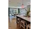 Bright kitchen featuring a breakfast bar with seating, chandelier, and view of dining area at 1306 Mordecai Dr, Raleigh, NC 27604