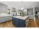 Modern kitchen with a large island, stainless steel appliances, and custom cabinetry at 1306 Mordecai Dr, Raleigh, NC 27604