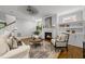 Cozy living room with fireplace, built-in shelving, and neutral decor at 1306 Mordecai Dr, Raleigh, NC 27604