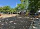 Community playground with swings, slides, and playset, providing a fun recreational area at 1306 Mordecai Dr, Raleigh, NC 27604