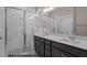 Bathroom features double sink vanity with granite countertops and glass-enclosed shower at 133 Pearl St # 7, Garner, NC 27529