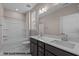 Well-lit bathroom with a double vanity, framed mirror, and a shower-tub combination at 133 Pearl St # 7, Garner, NC 27529