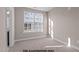Inviting bedroom with natural light, neutral walls, and cozy carpet for a serene feel at 133 Pearl St # 7, Garner, NC 27529